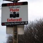 sign saying that traffic laws are photo enforced